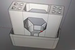 Screenshot of a custom 3D part model with shaped openings, internal walls, and an outer rim